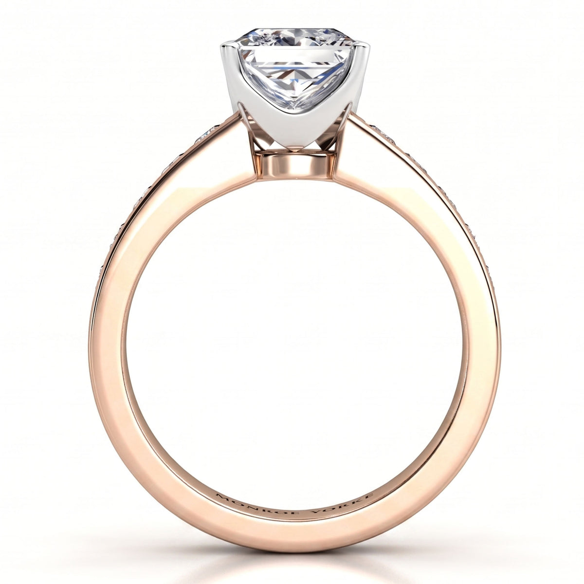 A rose gold solitaire engagement ring with a square shaped diamond in a silver-coloured setting, shown on a clean white background.