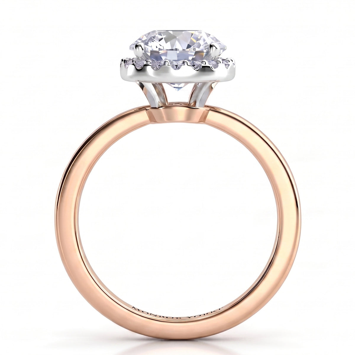 Alexa unique halo engagement ring in rose gold, front elevation of the round centre diamond and the halo set below the girdle.