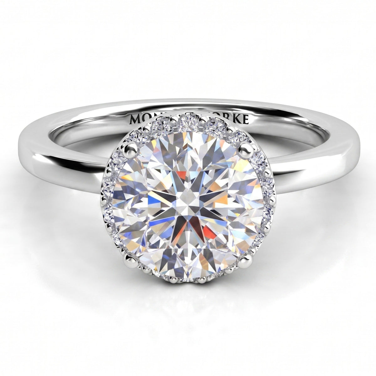 Alexa unique diamond engagement ring in white gold or platinum, top view showing the halo edge following the outline of the round centre diamond.