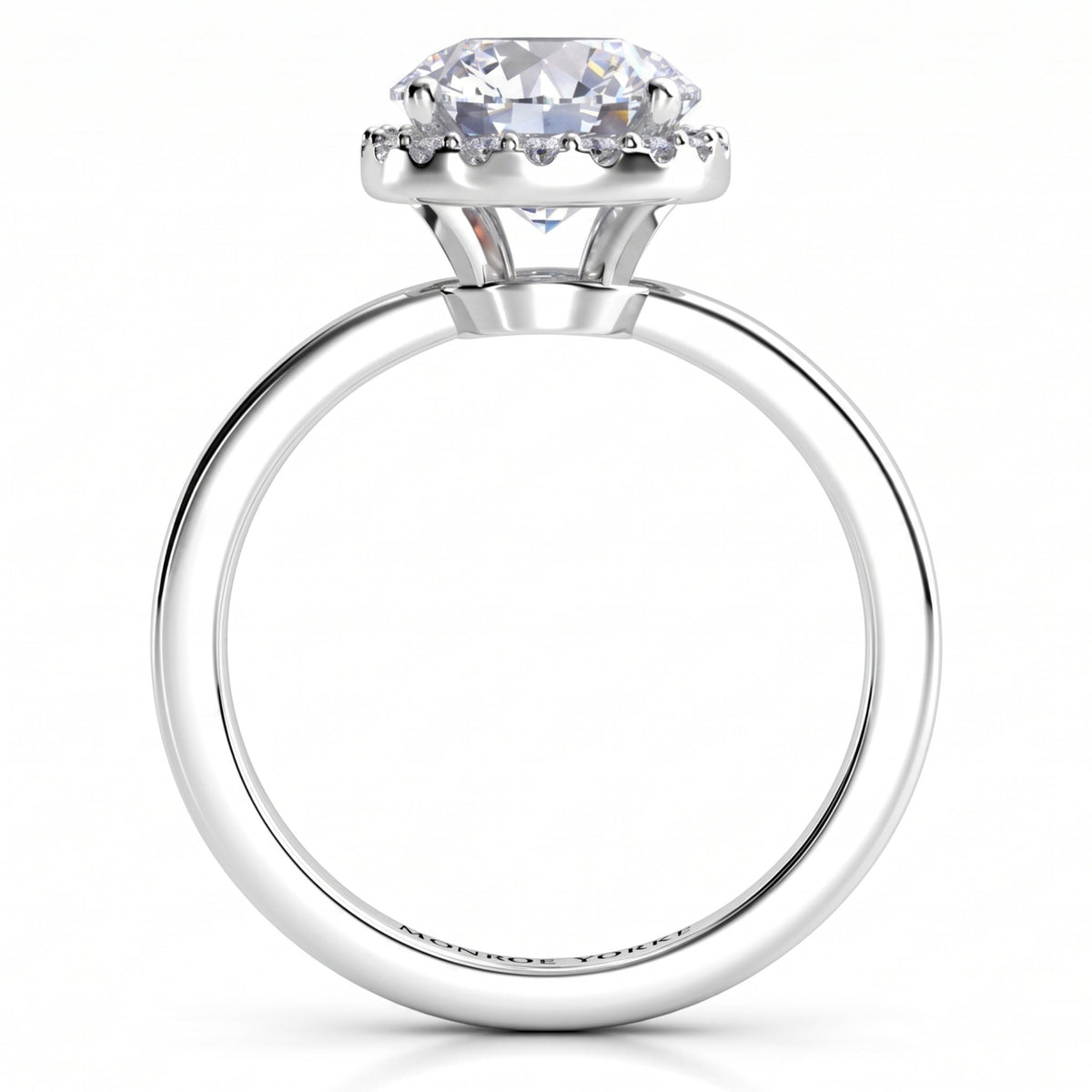 Alexa unique halo engagement ring in white gold or platinum, front elevation of the round centre diamond and the halo set below the girdle.