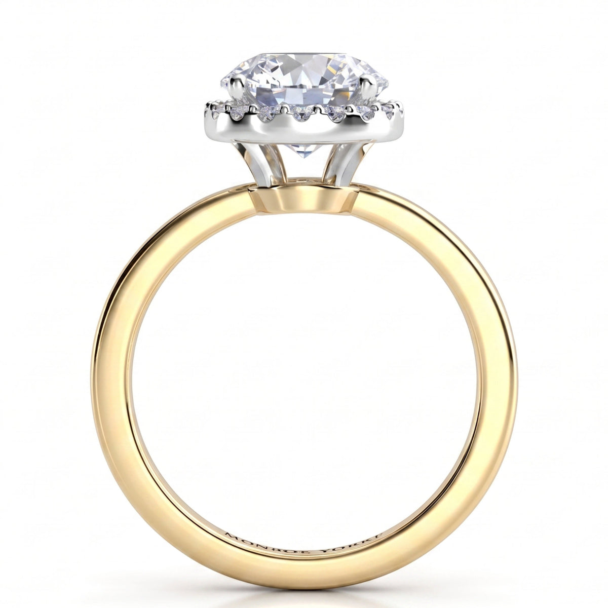 Alexa unique halo engagement ring in yellow gold, front elevation of the round centre diamond and the halo set below the girdle.