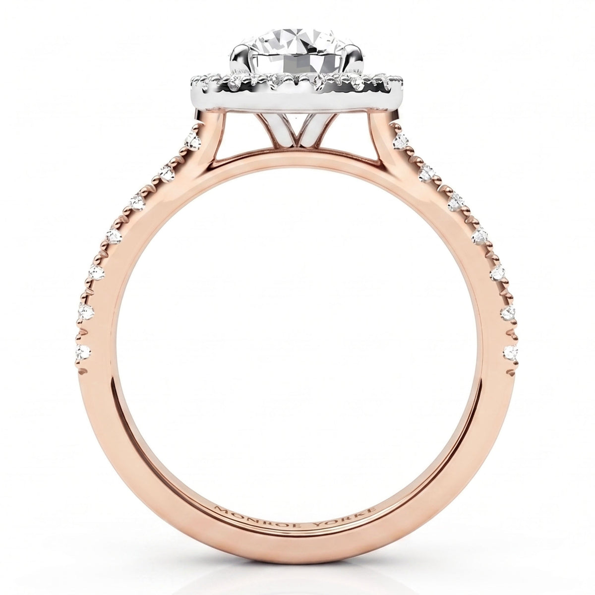 A rose gold engagement ring with a round-cut centre stone and a halo of small clear stones, shown on a clean white background.