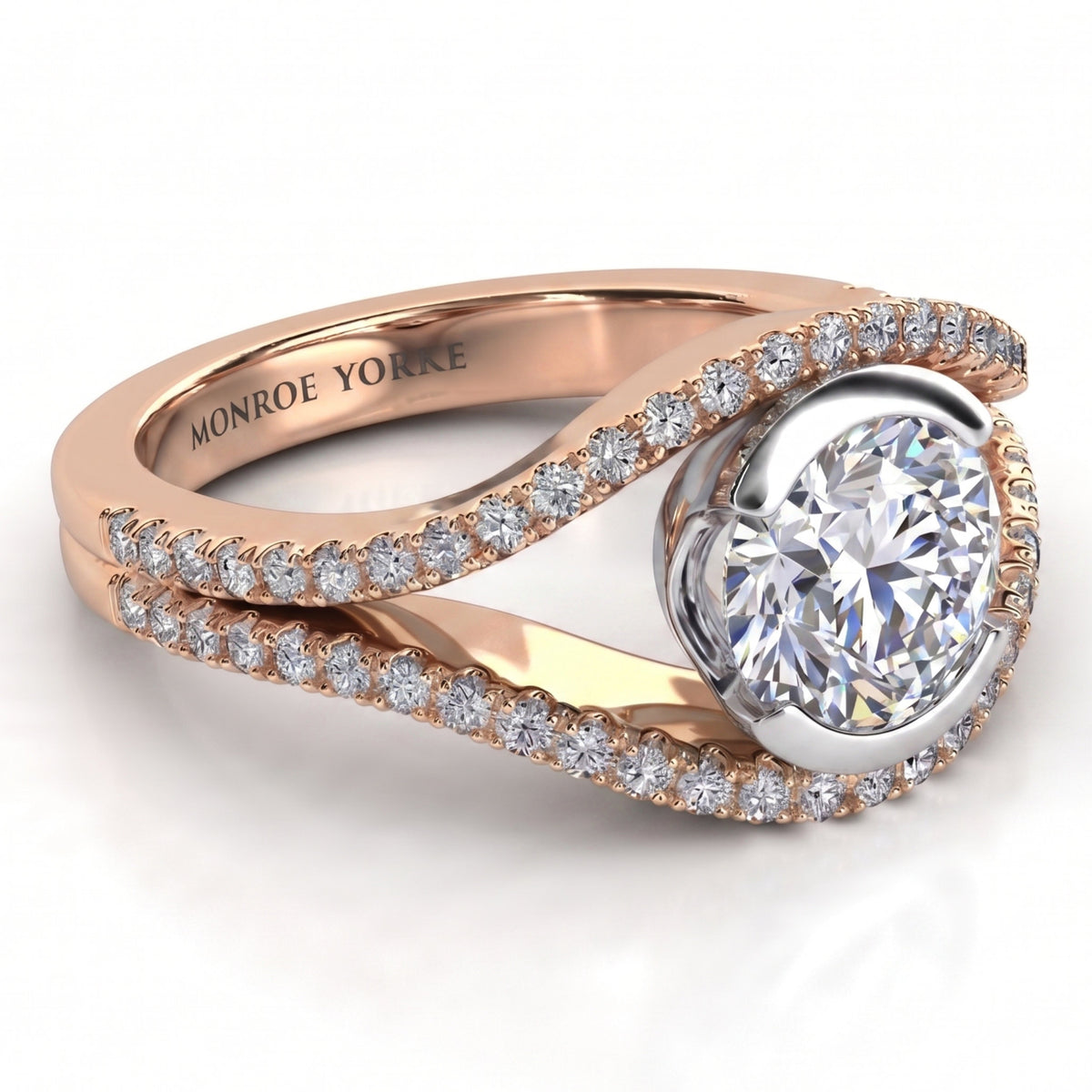 Capri rose gold engagement ring, studio view of the round brilliant centre diamond in a white metal setting between two diamond set bands.