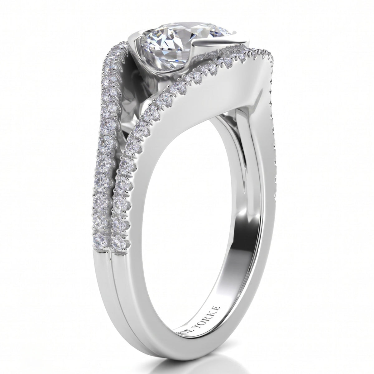 Capri engagement ring in white gold or platinum, close view of the round brilliant centre diamond and the micro claw set diamonds along both bands.