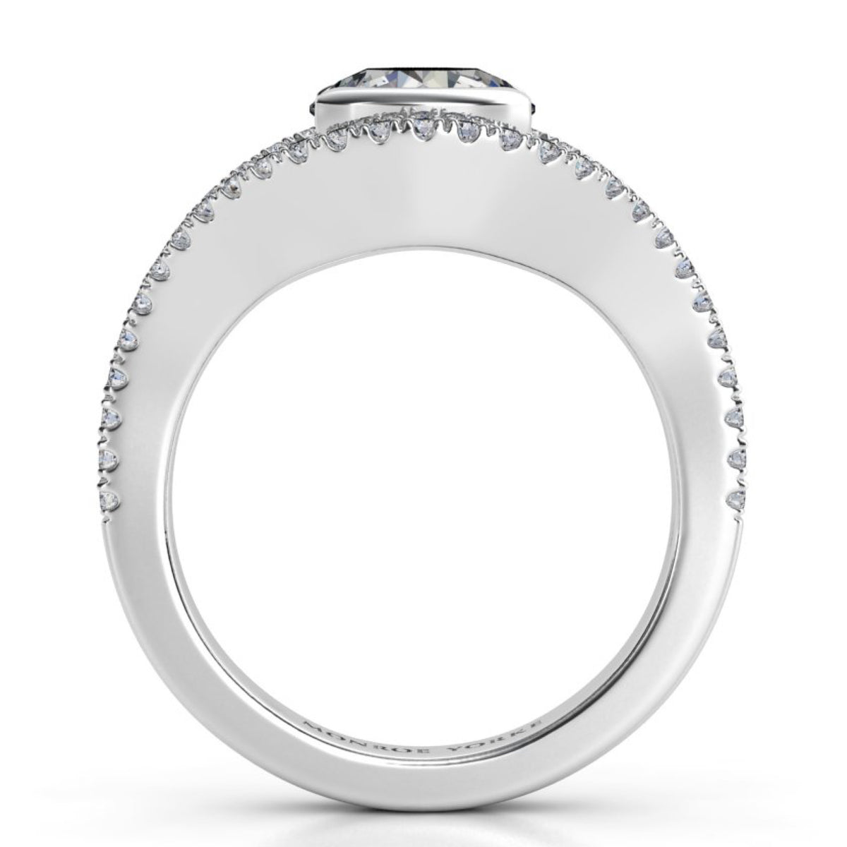 Capri halo engagement ring in white gold or platinum, side profile showing the half rub over setting and the diamonds running along both bands.