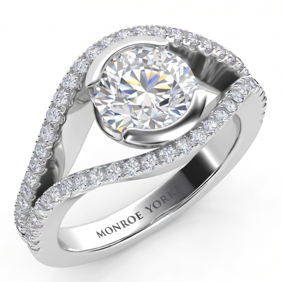 Capri halo engagement ring in white gold or platinum, angled view of the round brilliant centre diamond cradled between two diamond set bands that curve around it.
