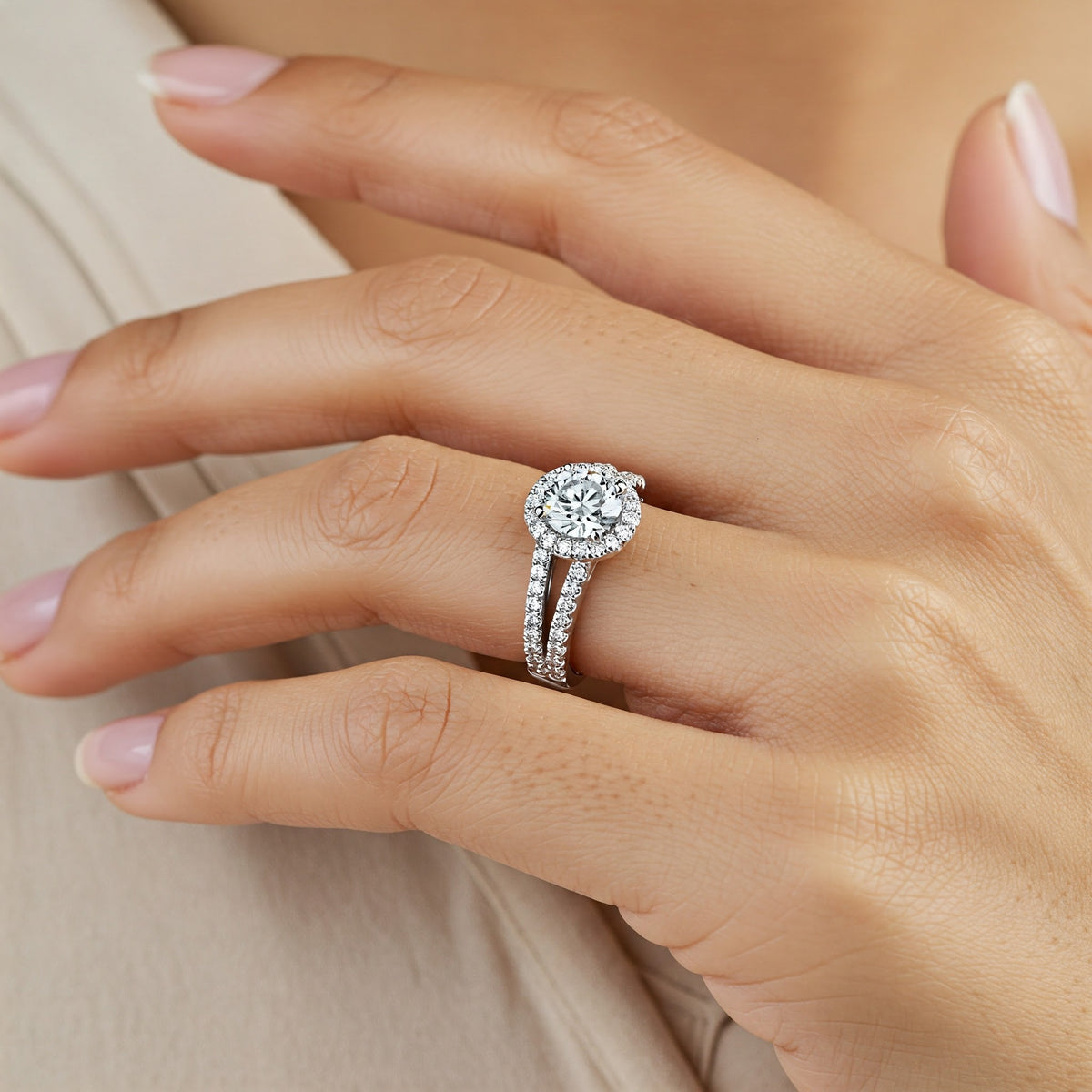 Ceduna - round diamond halo engagement ring with a split band set with diamonds. Shown on a girls hand — view 2