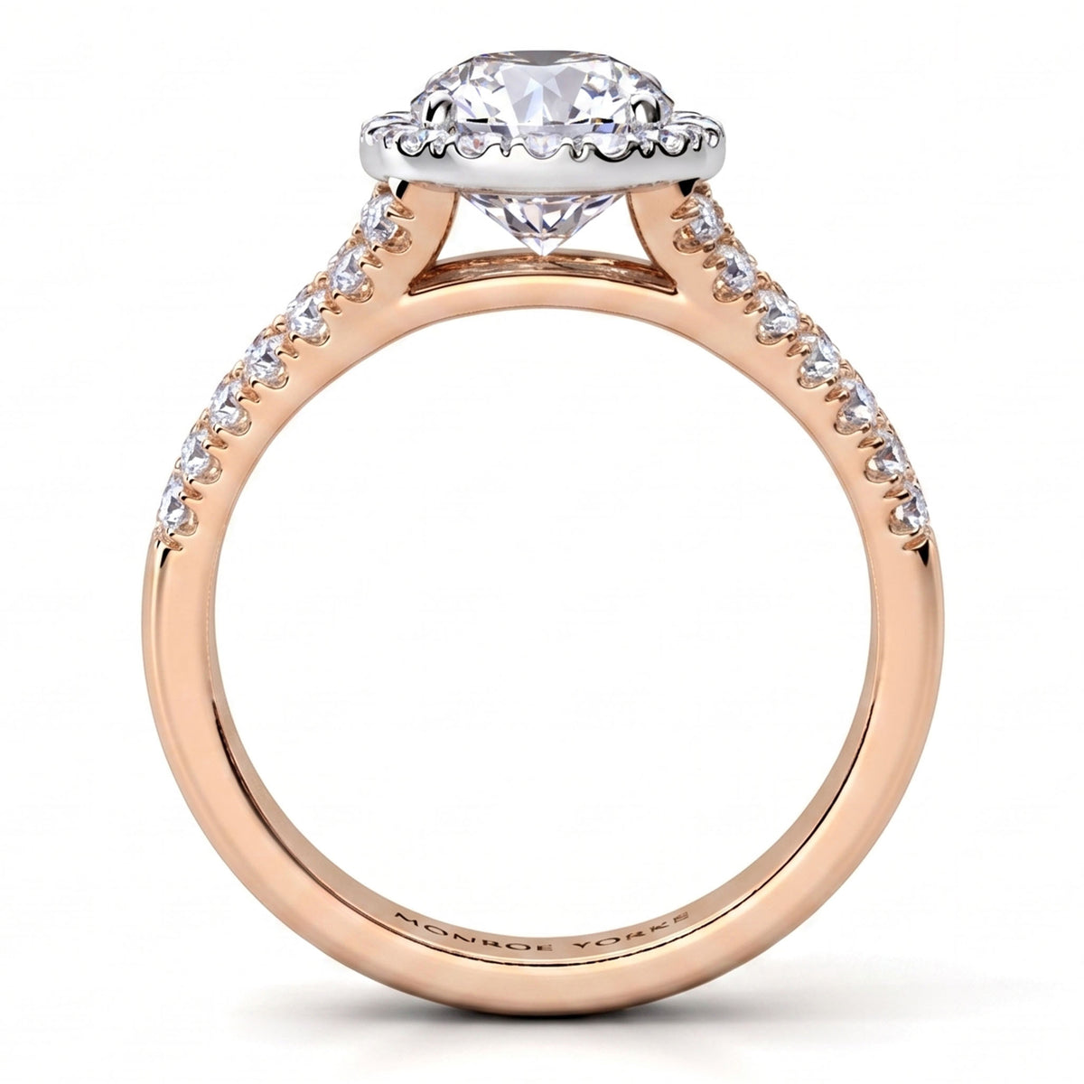 A rose gold engagement ring featuring a round-cut diamond centre stone in a scalloped halo, with small pavé diamonds along the shank, shown on a clean white background.