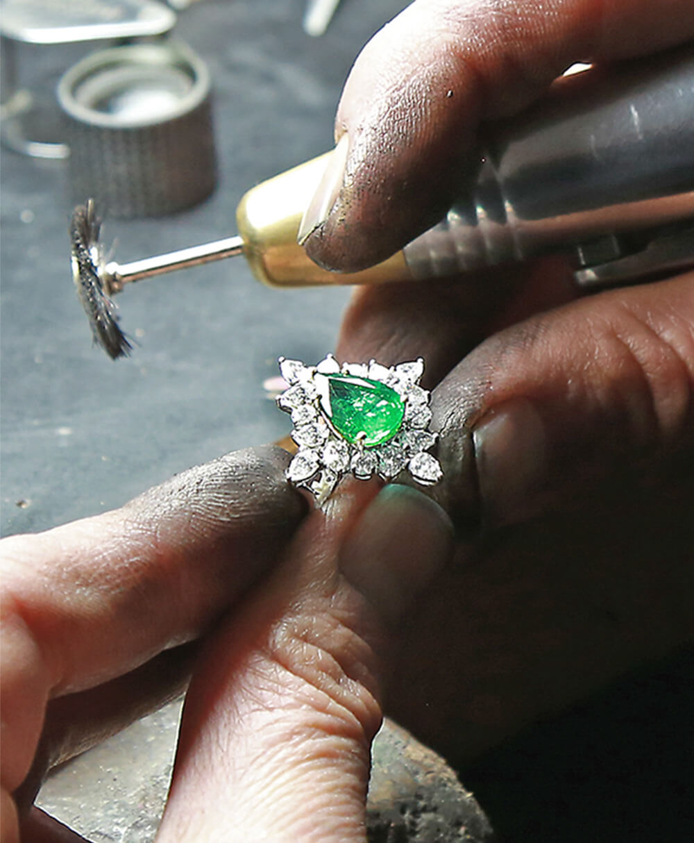 Australian Master Jeweller inspecting a diamond ring