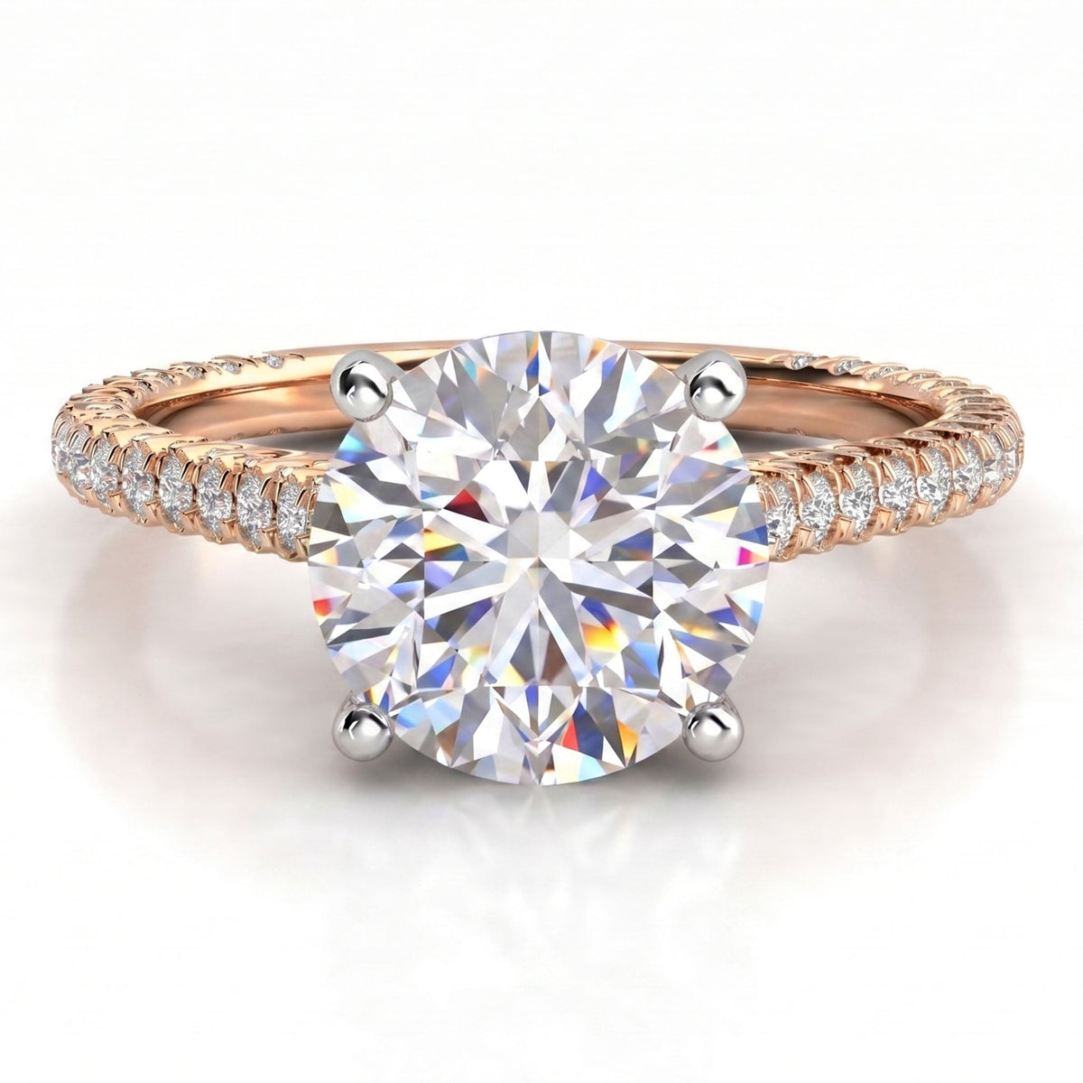 Elsie engagement ring in rose gold, showing the four claw centre setting and the pave-set band.
