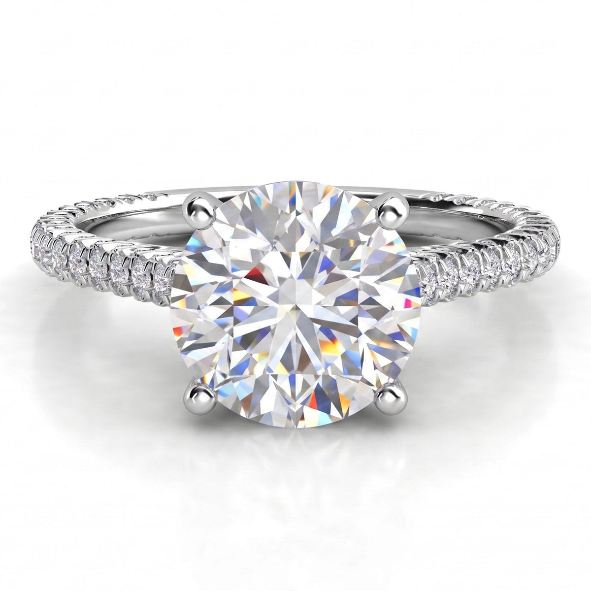 Elsie engagement ring in white gold or platinum, showing the four claw centre setting and the pave-set band.