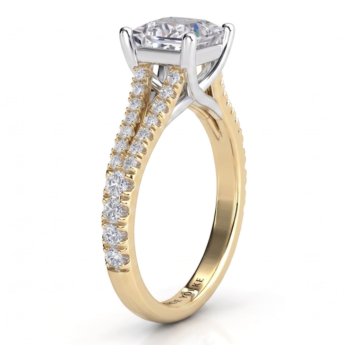 A yellow gold split band engagement ring featuring a large princess cut centre stone and a split shank pavé-set with smaller round stones, shown on a clean white background.