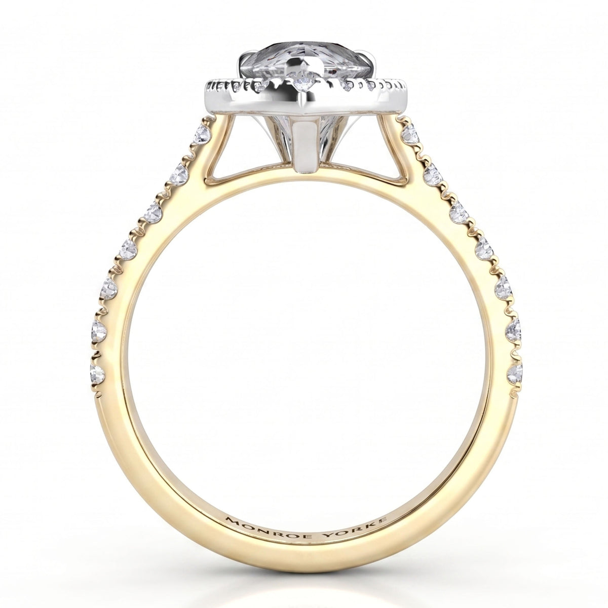 A yellow gold engagement ring featuring a pear-cut clear centre stone in a halo setting, with small pavé-set clear stones along the shank. Side view