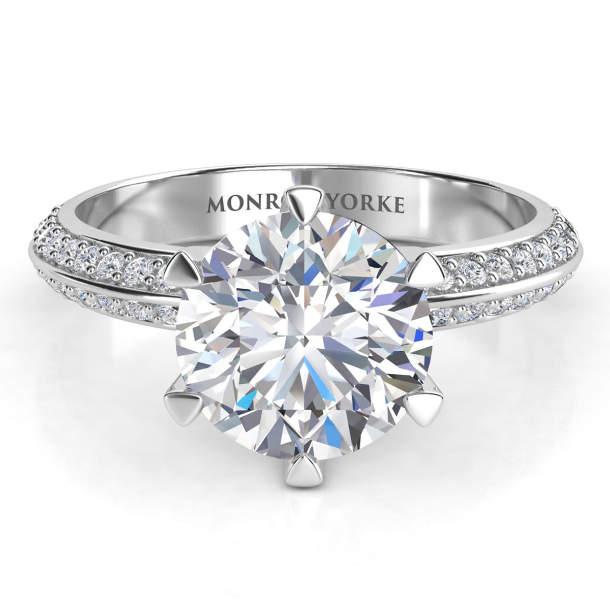 Juliet engagement ring in platinum or white gold, showing the six claw centre setting and the two rows of pave-set diamonds.