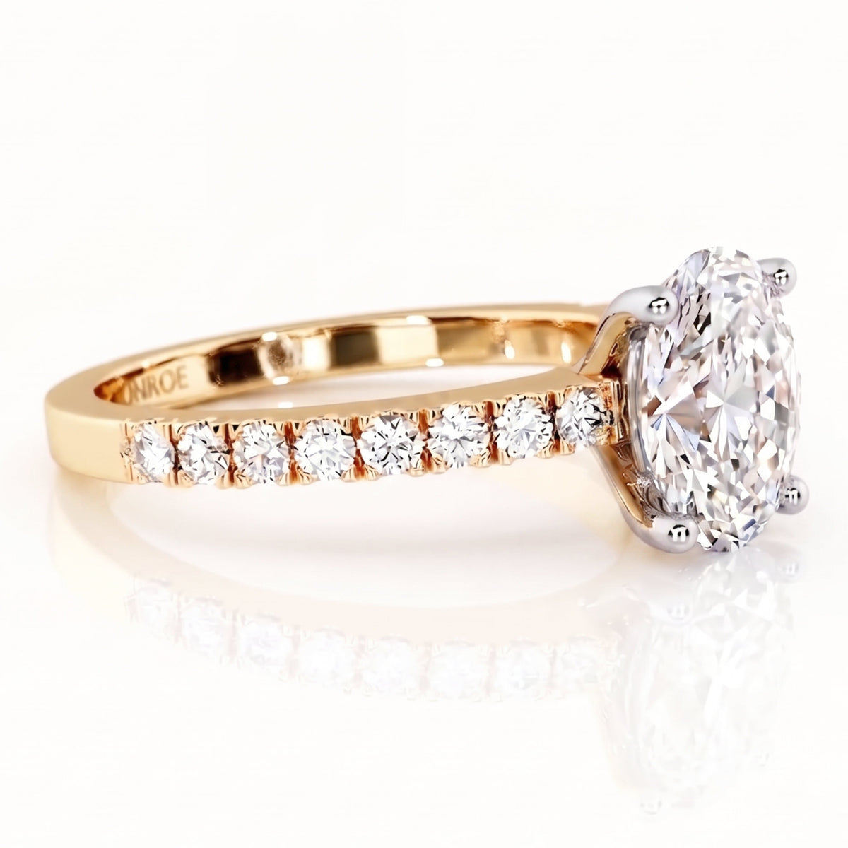 Kendall - yellow gold diamond engagement ring with an oval shaped centre diamond and diamonds on the band