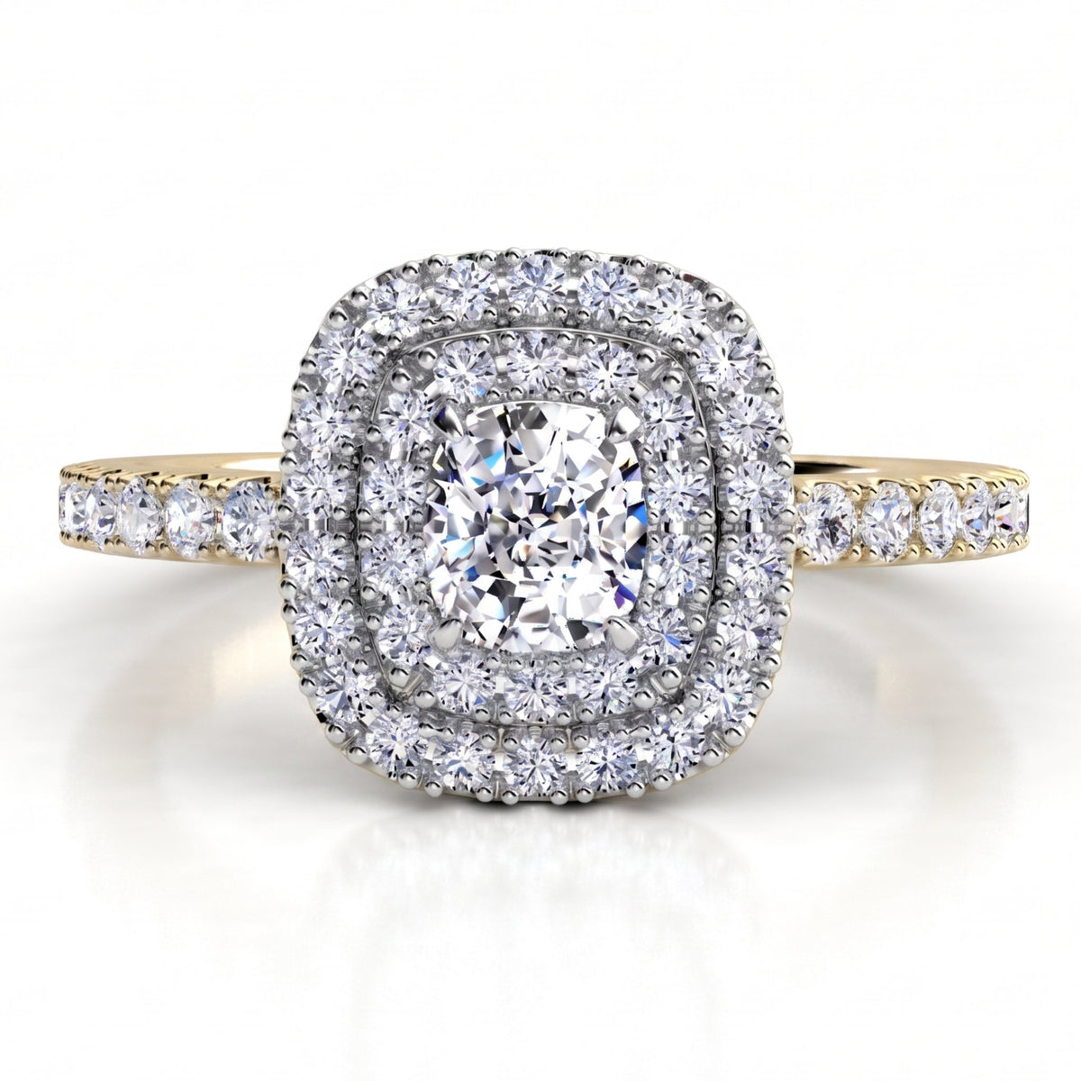 Norah double halo engagement ring with a yellow gold band, top view showing the cushion cut centre diamond ringed by an inner and outer halo of round brilliant diamonds.