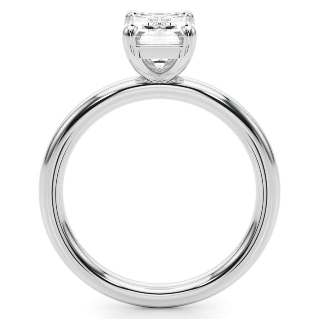 Skye emerald cut Diamodn solitaire ring, side view. Round band with a low centre setting