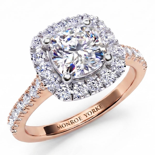 Summer - diamond engagement ring with a cushion cut diamond surrounded by a halo of diamonds. Plus diamonds on the band. Rose Gold