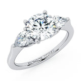 Adele - diamond trilogy ring with a centre round brilliant cut diamond and pear cut diamonds on side.  18ct white gold. 