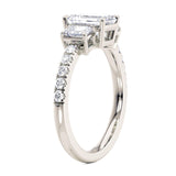 Adele emerald cut three diamond in platinum.  Side view showing 