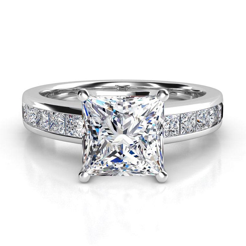 Albany White Gold.  Front view. princess cut diamond centre with channel set princess cut diamonds on the band.