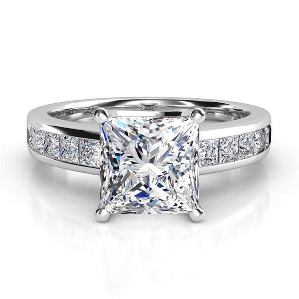 Albany White Gold. Front view. princess cut diamond centre with channel set princess cut diamonds on the band.