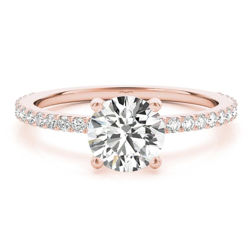 April - Rose gold ring. 4 claw round diamond engagement ring with diamonds on the band.