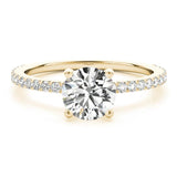 April Gold Round Diamond Engagement Ring. 4 claw centre setting. Diamonds on the band. 