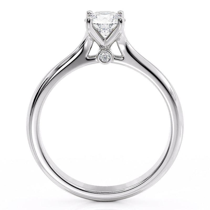 Asti - White gold diamond solitaire ring. 4 claw setting. Side view showing diamond set under the centre setting — view 2