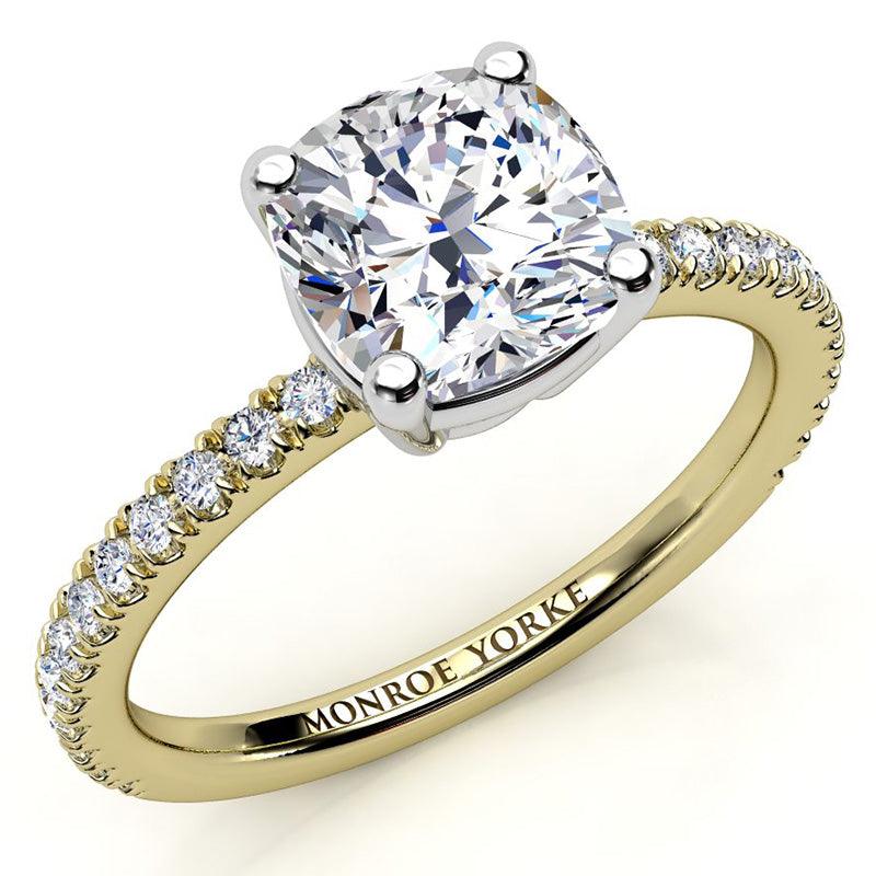 Cushion cut diamond engagement ring with diamonds on the band. yellow gold