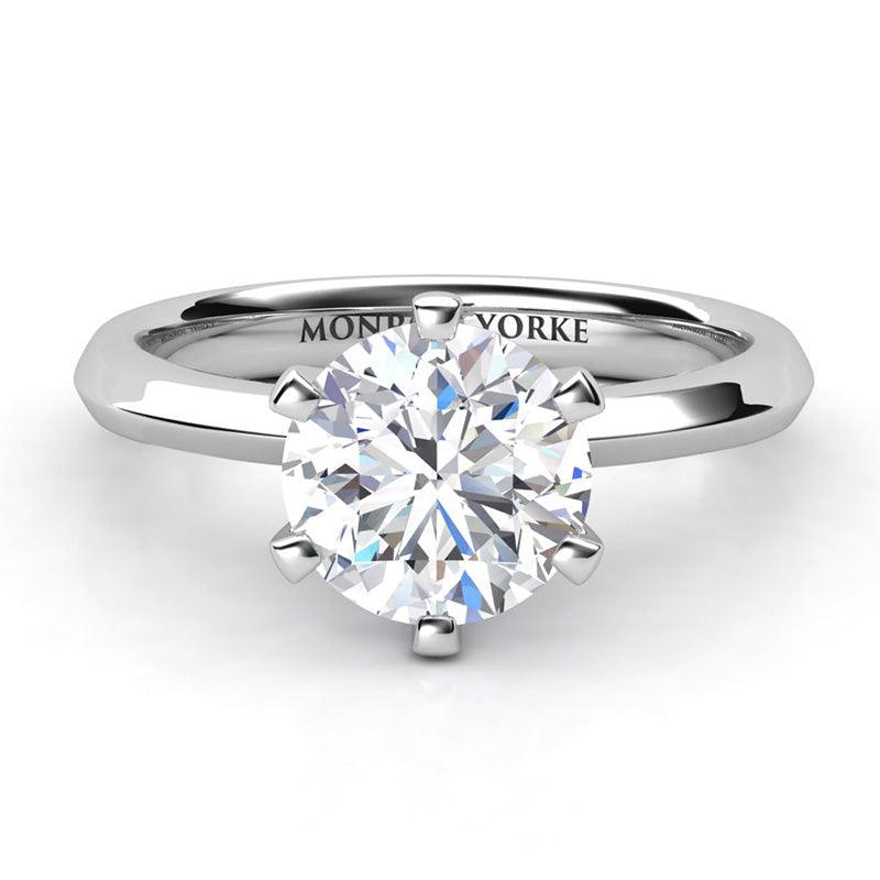 Calais - 18ct White gold, six claw classic solitaire diamond engagement ring.  Knife edge band. Front view.