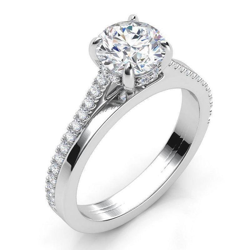 Calida white gold - Round Diamond Engagement Ring with side diamonds. 