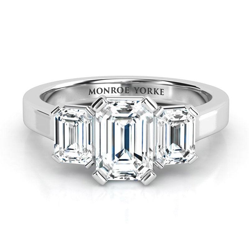 Calista - Emerald cut diamond trilogy ring.  Emerald cut three diamond ring. 18ct white gold