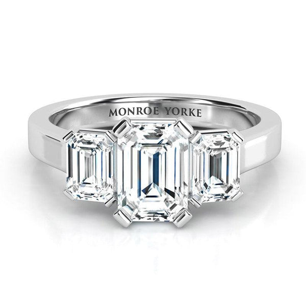 Calista Platinum. Emerald cut three stone ring, three diamond ring