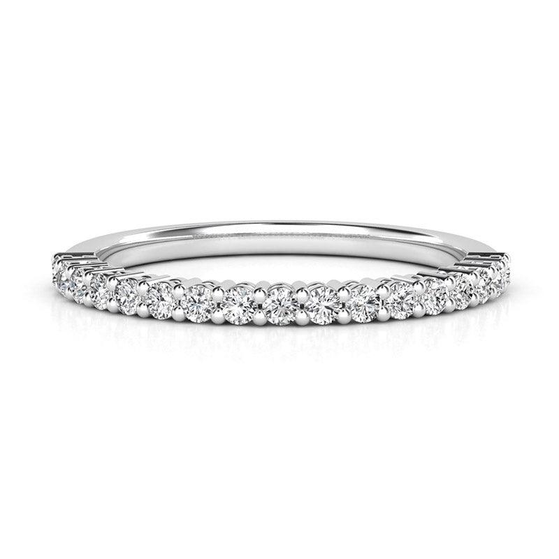 Callisto - Claw set diamond wedding ring.  0.35 carats of diamonds. White gold or platinum 