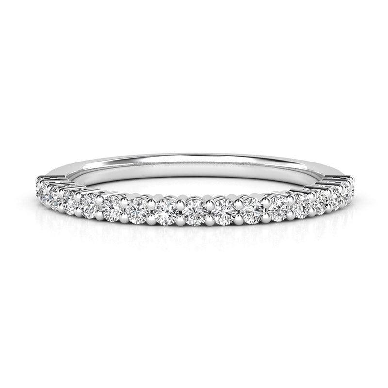 Callisto - Claw set diamond wedding ring.  0.35 carats of diamonds. White gold or platinum