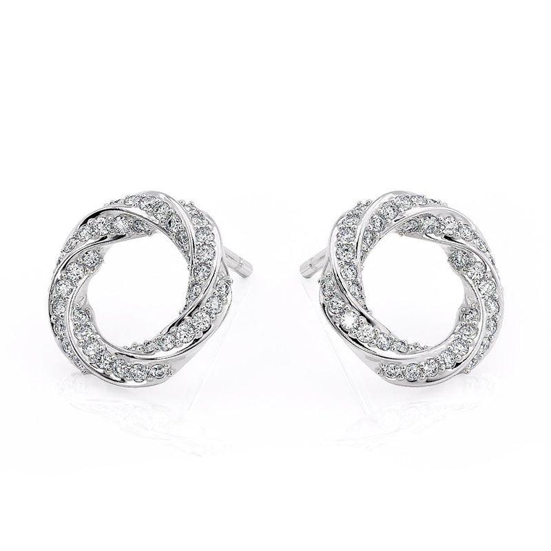 Camila - white gold diamond spiral earrings. Diamonds pave set into a spiral pattern. Front view, view 1