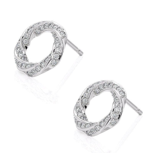 Camila - white gold diamond spiral earrings. Diamonds pave set into a spiral pattern. Side view