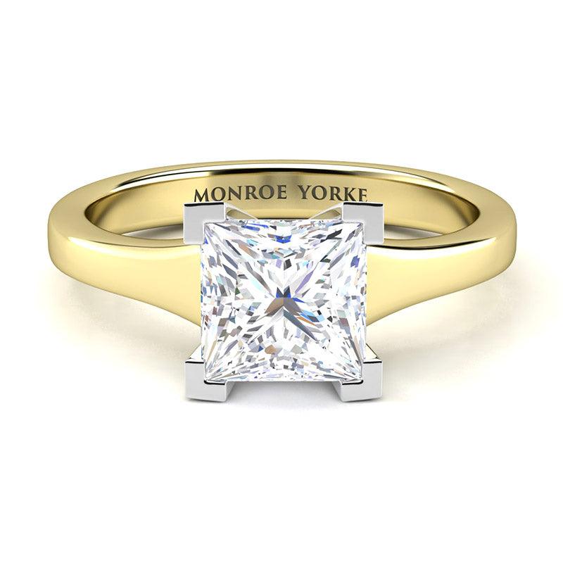 Princess cut diamond solitaire ring.  Yellow gold band and white gold centre setting.  Chester