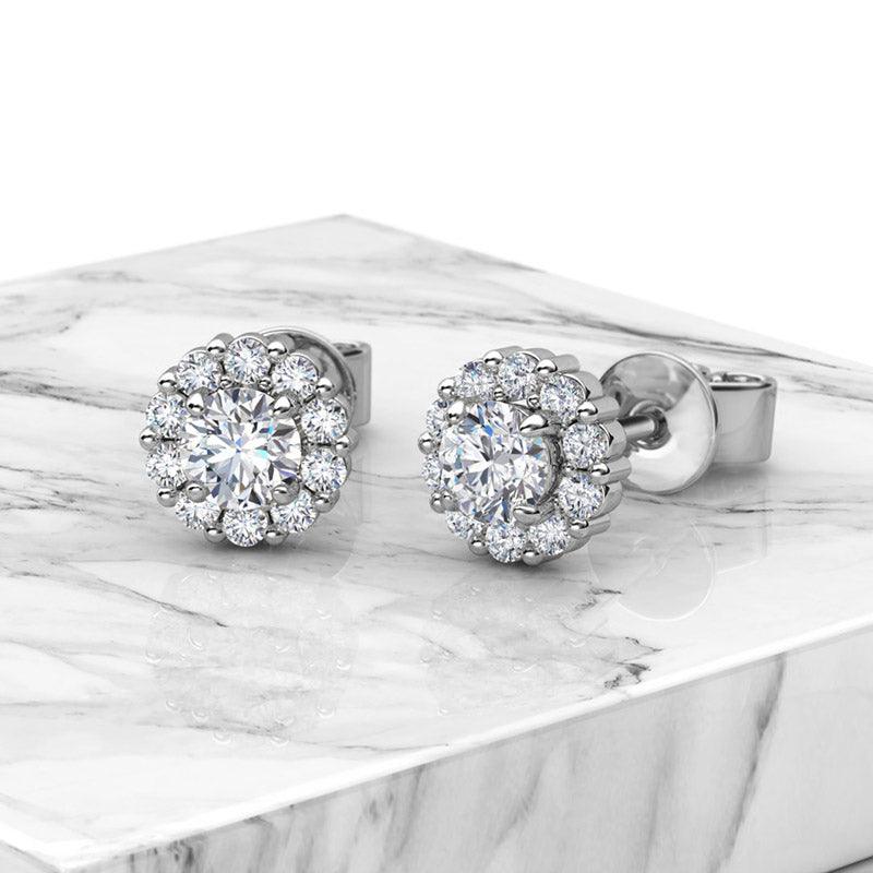 Daisy - diamond earrings. 0.20 carats centre diamond with halo of diamonds. Total 0.70 carats. , view 3