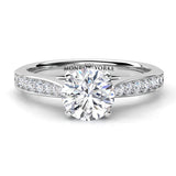 Denver GIA certified round diamond engagement ring with the centre diamond in a four claw setting.  Diamond set band that tapers into the centre setting. 18ct white gold