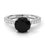 Desir - Black diamond ring in platinum.  Top view. Centre round black diamond 1.70 carats. Centre diamond in a 4 claw setting