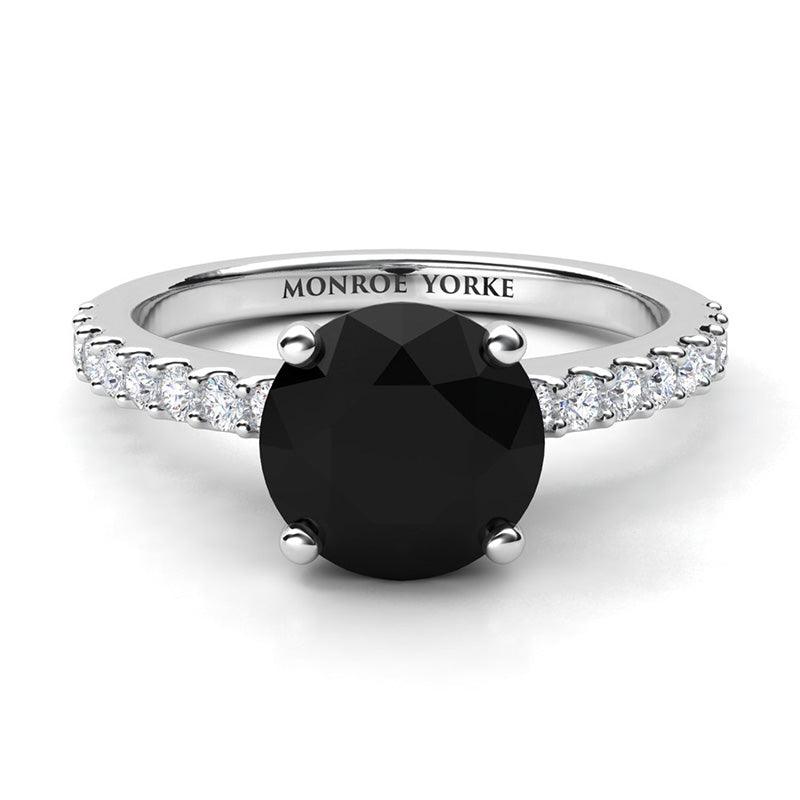 Desir - Black diamond ring in platinum.  Top view. Centre round black diamond 1.70 carats. Centre diamond in a 4 claw setting
