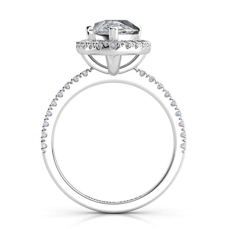 Dune pear cut diamond halo ring. Side view 2 showing beautiful centre diamond halo setting and diamond set band. 18ct white gold