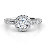 Ecco - round diamond halo ring with a low centre setting. 18ct white gold 