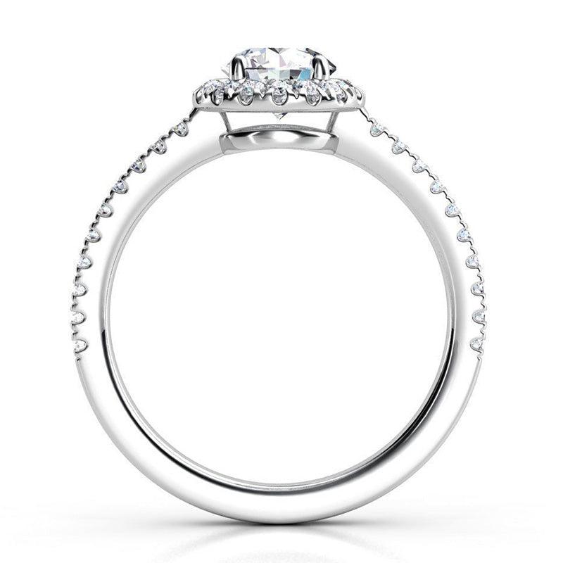 Ecco in platinum - Side view: round diamond halo ring with a low centre setting.  