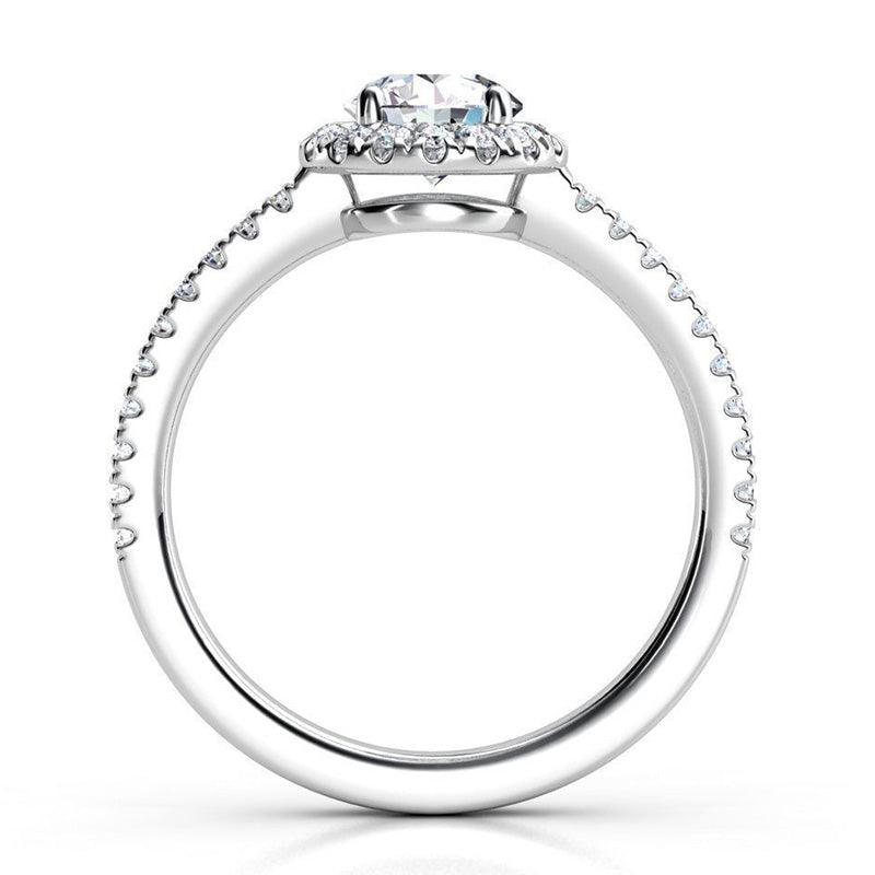 Ecco in platinum - Side view: round diamond halo ring with a low centre setting. — view 5