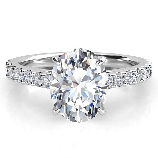 Oval Cut Diamond Ring in platinum with diamonds on the band.