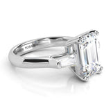 Envy - 18ct White gold. Emerald and tapered baguette diamond three stone ring.  Side view