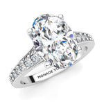Finley engagement ring in white gold.  Centre premium oval cut diamonds.  Graduated band with diamonds